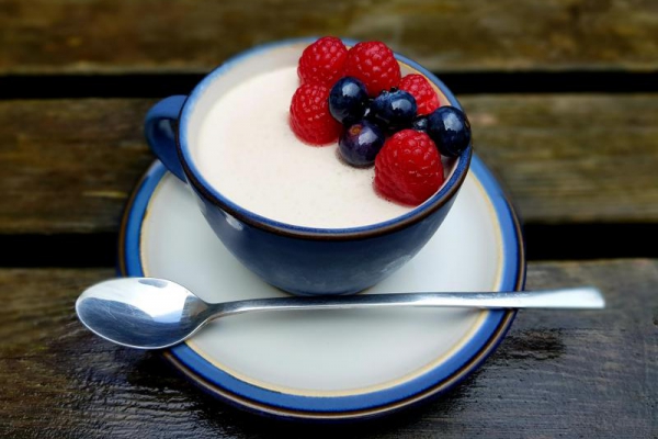 Strawberry tea and yoghurt panna cotta with thyme-macerated fruit