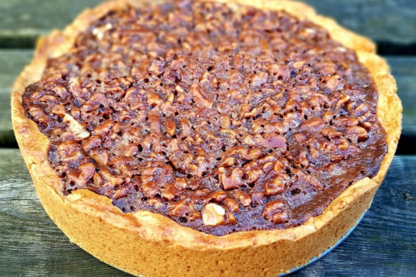 Dark chocolate and walnut tart with crème fraîche