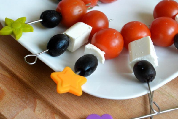 Toothpick party appetizers with olives, feta cheese and cherry tomatoes